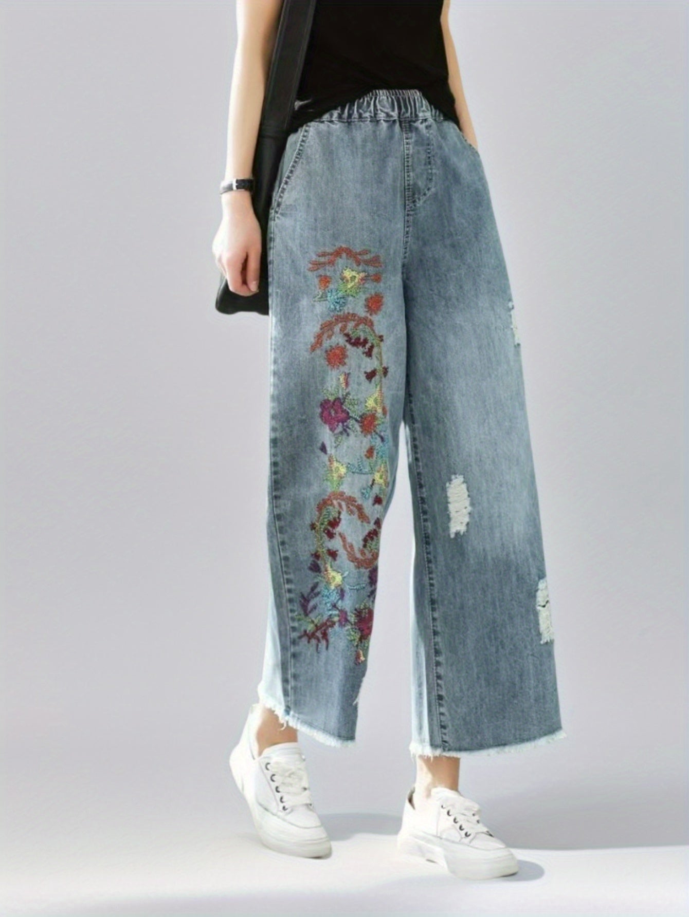 Jeans With The Right Leg Embroidered