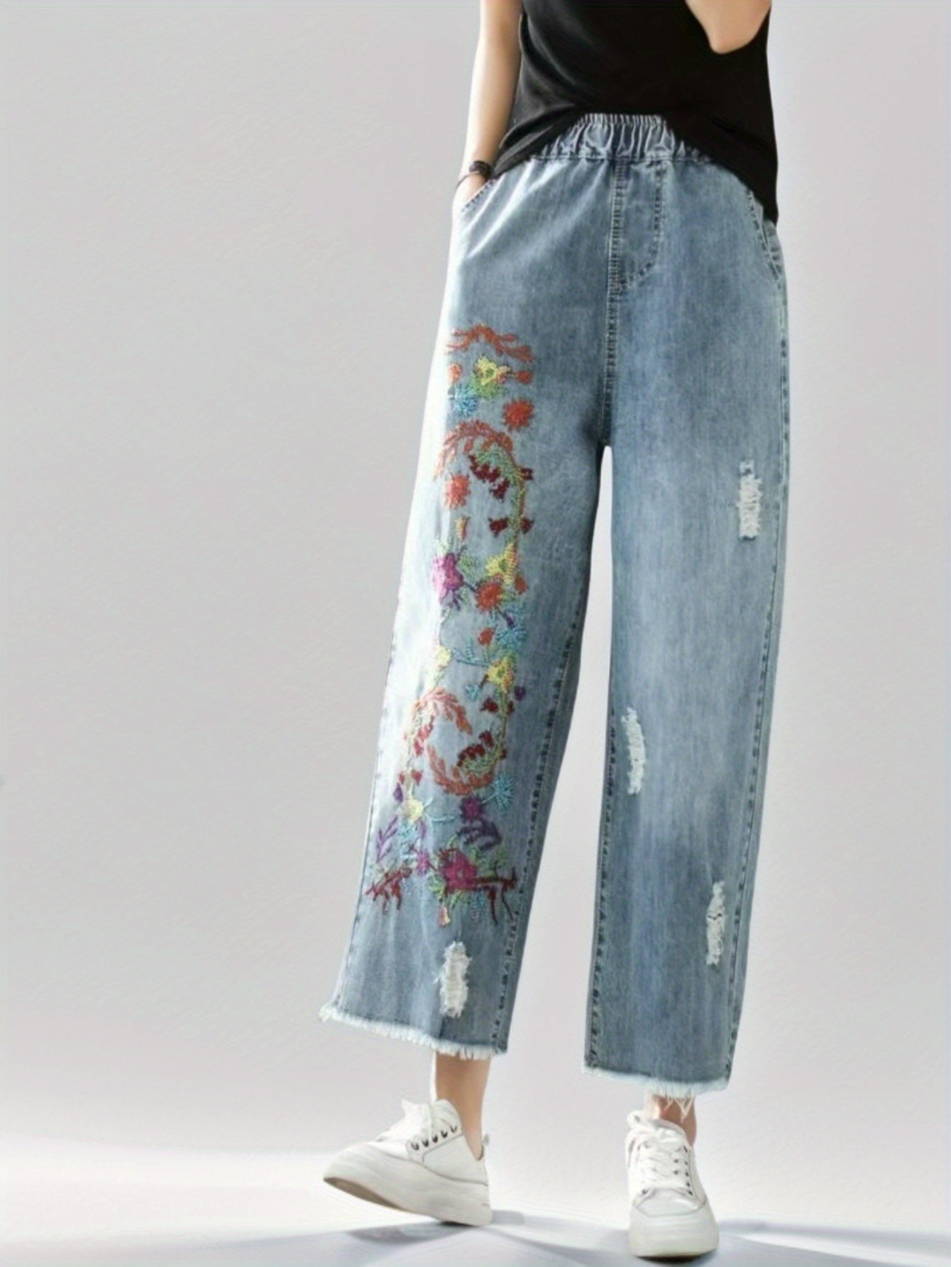 Jeans With The Right Leg Embroidered