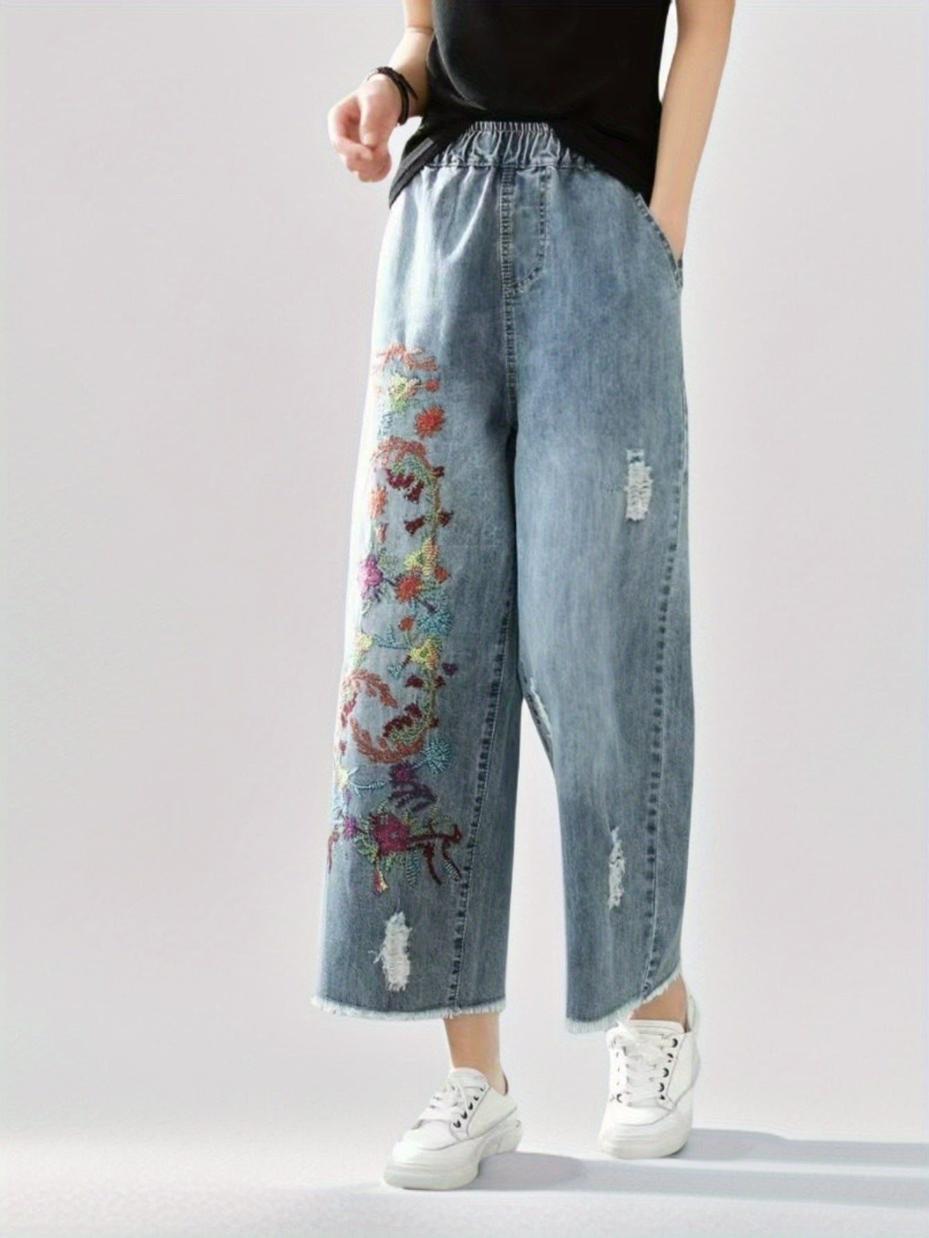 Jeans With The Right Leg Embroidered