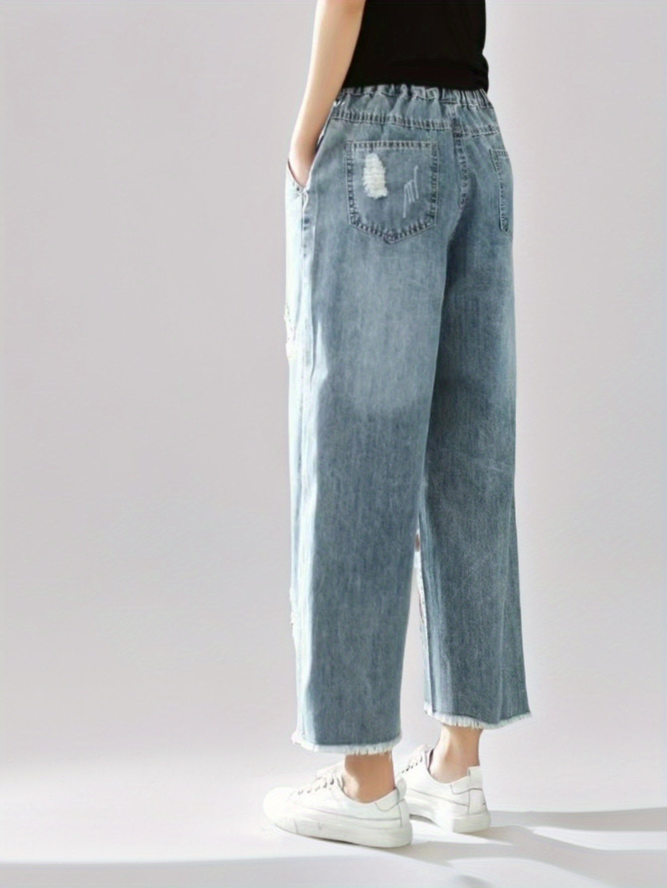 Jeans With The Right Leg Embroidered